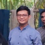 Portrait of happy young woman with clear radiant skin holding natural beauty products
